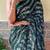 green sequinned poly georgette saree