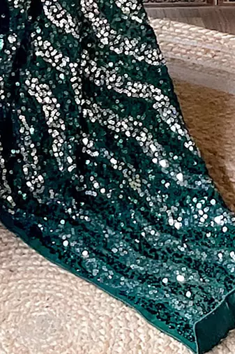 green sequinned poly georgette saree
