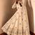 Beige peacock feather embroidered silk gown with pant & dupatta