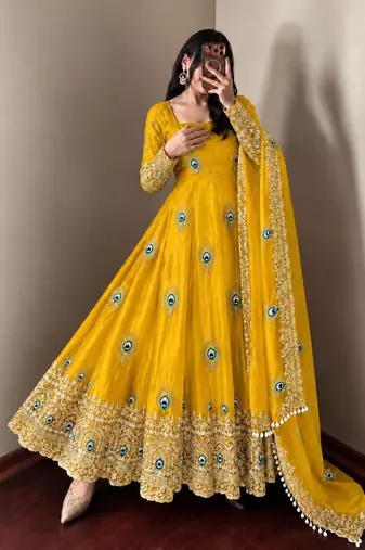 Yellow peacock feather embroidered silk gown with pant & dupatta