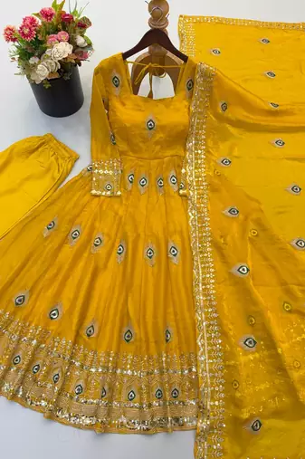 Yellow peacock feather embroidered silk gown with pant & dupatta