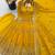 Yellow peacock feather embroidered silk gown with pant & dupatta