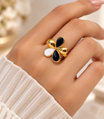 Gold-tone finish, glossy enamel petals, lightweight fit, flower design.