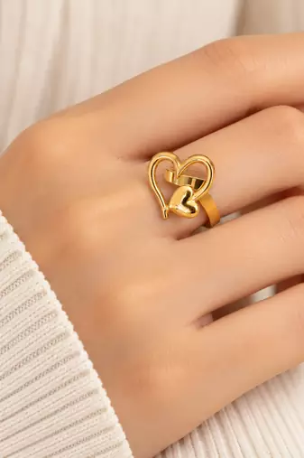 Dual heart design, polished finish, bold cocktail ring, romantic style.