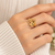Dual heart design, polished finish, bold cocktail ring, romantic style.