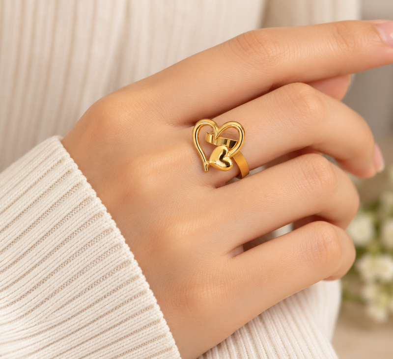 Dual heart design, polished finish, bold cocktail ring, romantic style.