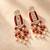 Gold plated red kundan earrings
