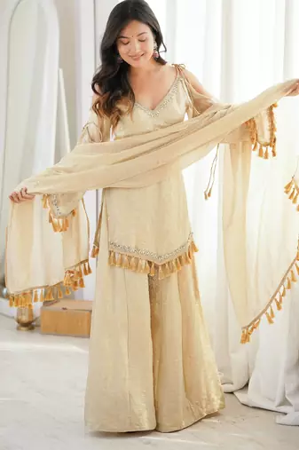 Beige silk blend readymade suit with mirror & border work