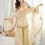 Beige silk blend readymade suit with mirror & border work