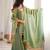 Sage silk blend readymade suit with mirror & border work