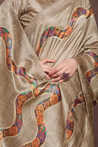 beige embroidered tussar saree