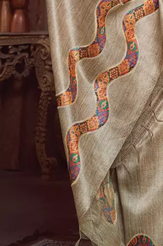 beige embroidered tussar saree