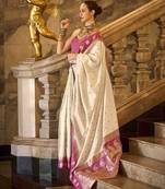 cream ethnic motifs woven design saree