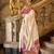 cream ethnic motifs woven design saree