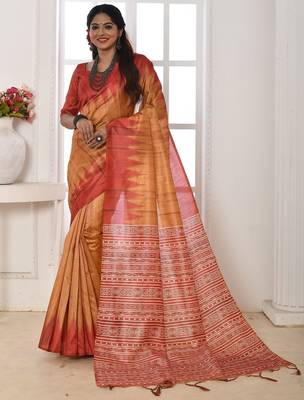 orange geometric printed tussar silk sarees with tassels 1