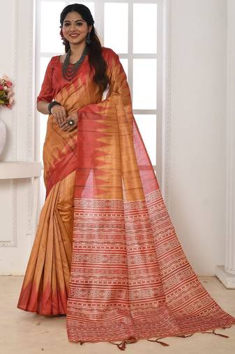 orange geometric printed tussar silk sarees with tassels