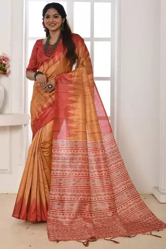 orange geometric printed tussar silk sarees with tassels