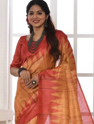 orange geometric printed tussar silk sarees with tassels 3