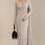 Midnight noir beaded fringe bucket bag