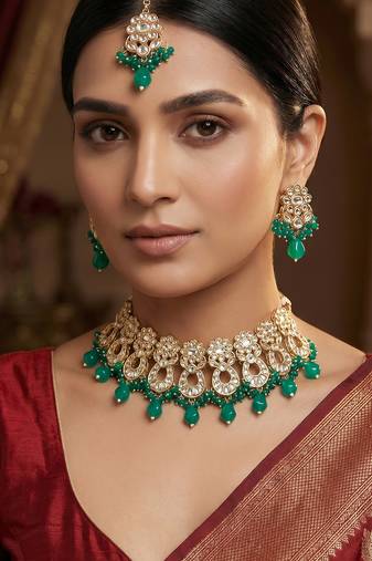 Green kundan choker necklace set with earrings and maangtika
