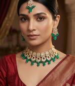 Green kundan choker necklace set with earrings and maangtika