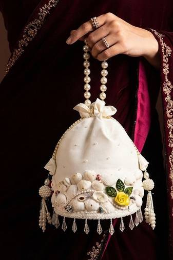 Ivory floral shell embellished potli bag