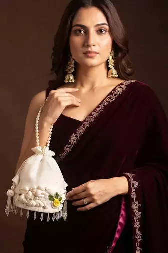 Ivory floral shell embellished potli bag