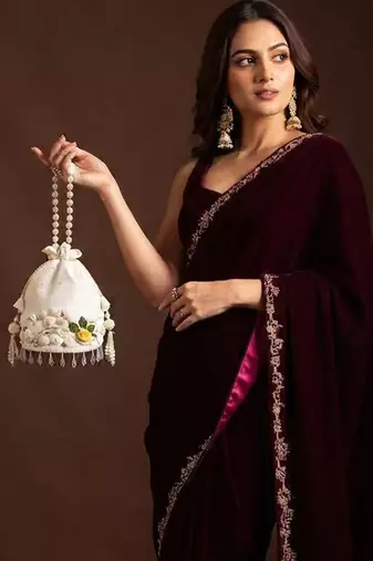 Ivory floral shell embellished potli bag