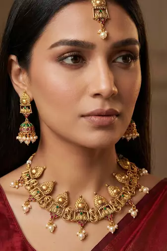 Antique gold temple choker necklace set with jhumka earrings and maangtika