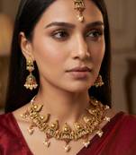 Antique gold temple choker necklace set with jhumka earrings and maangtika