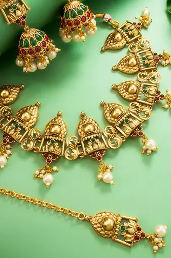 Antique gold temple choker necklace set with jhumka earrings and maangtika