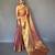 peach peach-coloured & gold-toned woven design zari tissue saree