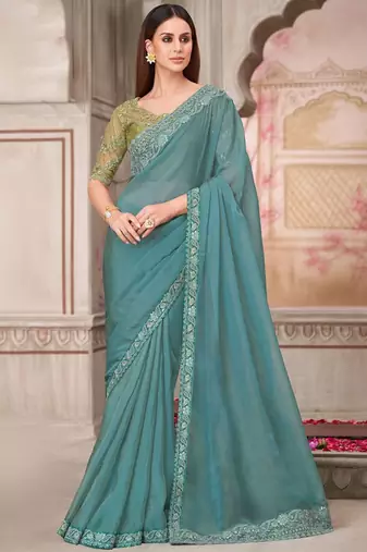 turquoise sequinned pure georgette saree