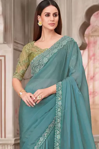 turquoise sequinned pure georgette saree