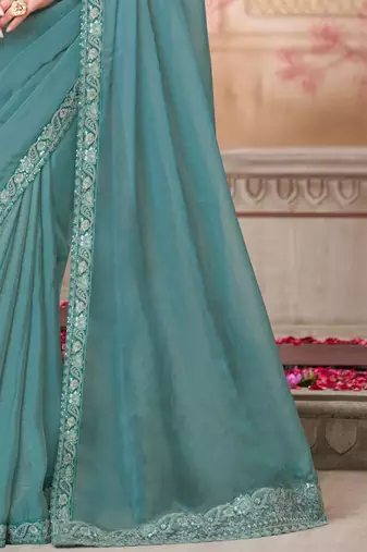 turquoise sequinned pure georgette saree