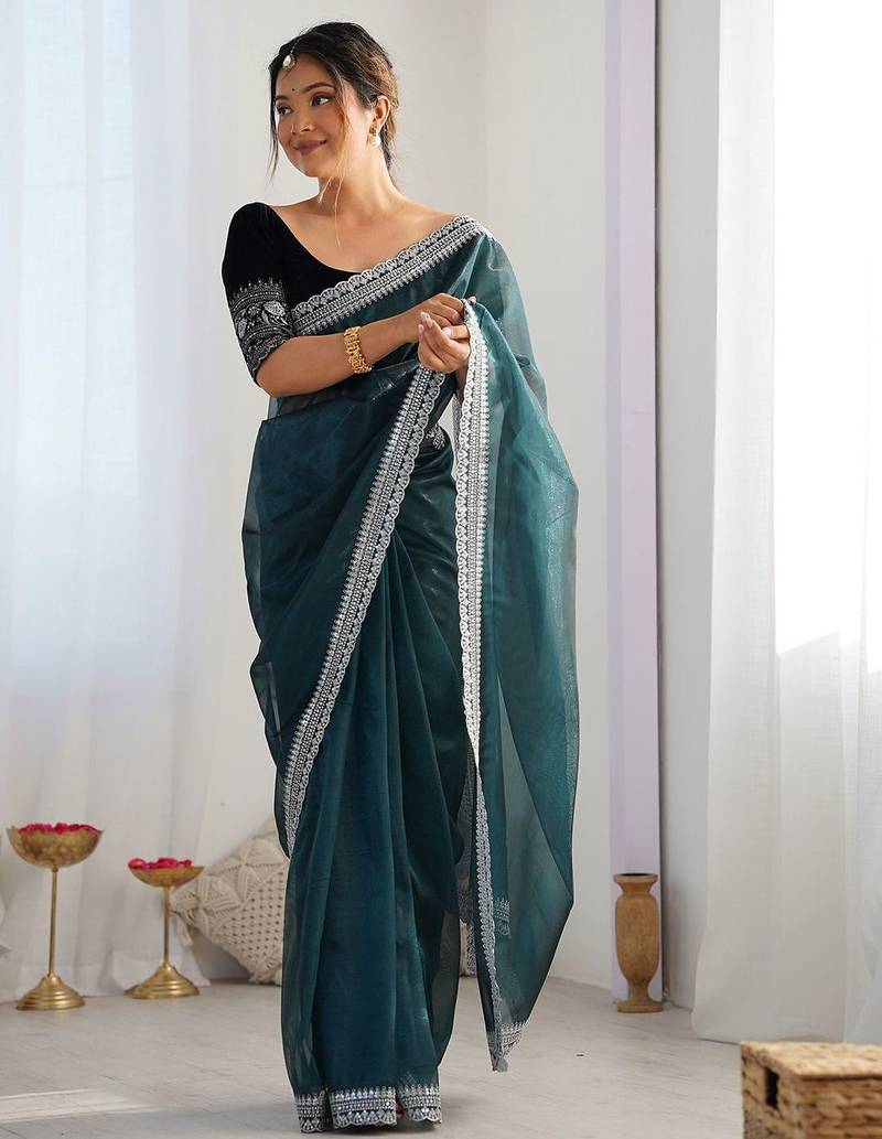 teal embroidered sequinned net saree