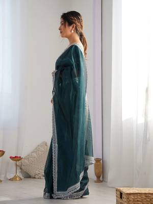 teal embroidered sequinned net saree 2
