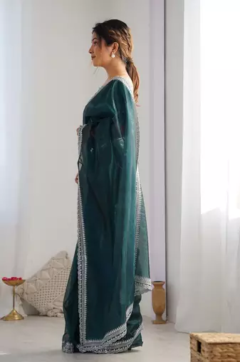 teal embroidered sequinned net saree