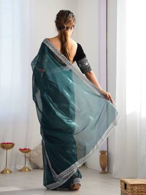 teal embroidered sequinned net saree 3