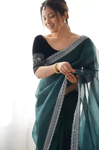 teal embroidered sequinned net saree