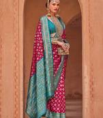 pink pink & blue ethnic motifs printed zari patola saree