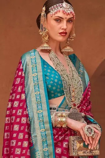 pink pink & blue ethnic motifs printed zari patola saree