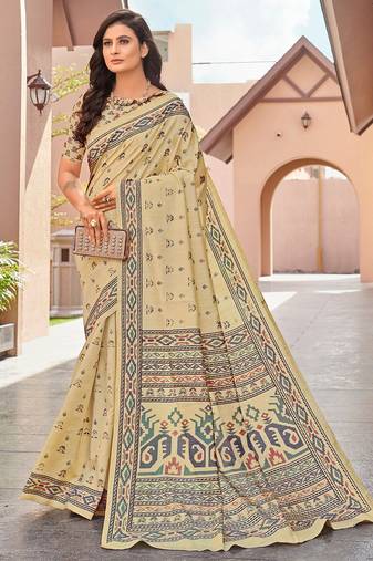 beige beige & green ethnic motifs art silk ikat saree