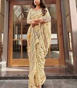 beige beige & pink ethnic motifs art silk ikat saree