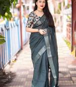 teal embellished zari linen saree