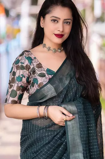 teal embellished zari linen saree