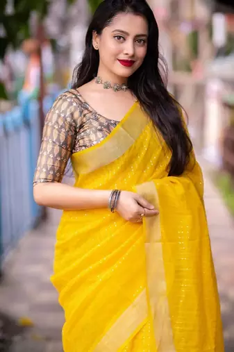 yellow embellished zari linen saree