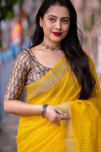 yellow embellished zari linen saree