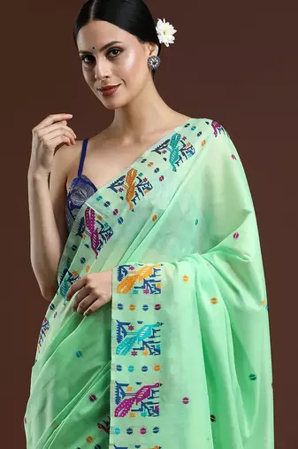 green woven design zari muga saree
