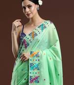green woven design zari muga saree
